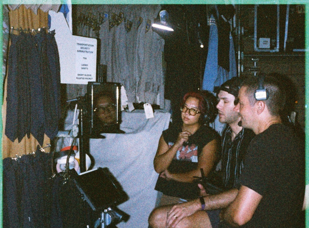Three crew members at the monitor