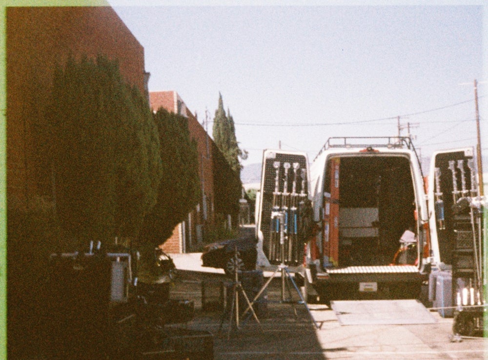 The grip van, doors open, stands racked