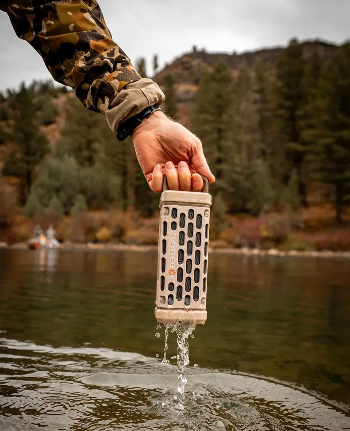 Turtlebox Ranger speaker dripping water at the river — Fish Camp monthly giveaway
