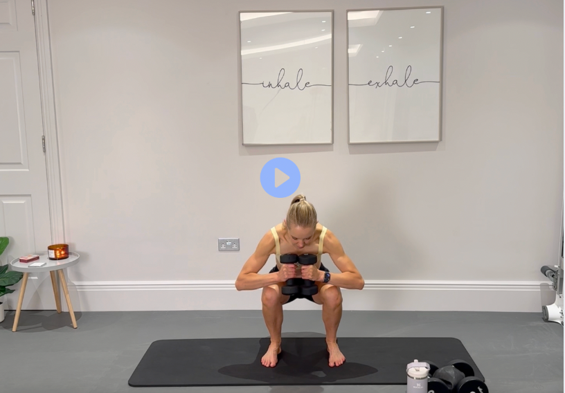 Loaded Lift: black workout set, holding dumbbells at the chest in a deep squat.