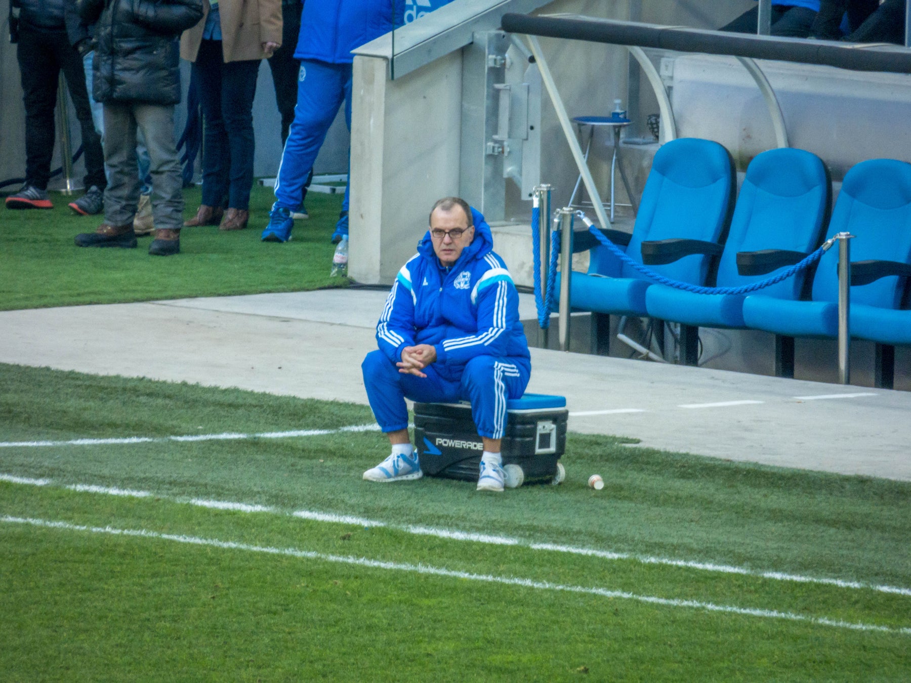Marcelo Bielsa sitting on his cool box on the touchline at Marseille, 2015
