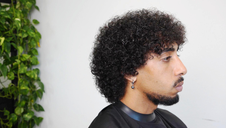 Round shapes, man's haircut.