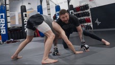 Two fighters in wrestling stance