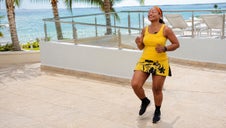 Lisa leading an upbeat outdoor dance fitness workout by the pool