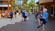 Adults enjoying an outdoor low-impact cardio and kickboxing workout