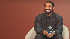 Michael B. Jordan smiling, seated with a microphone on the Culture Stage at CultureCon 2026