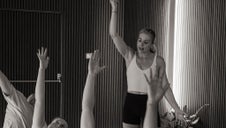 Yoga teacher guiding a class