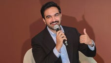 Mayor Zohran Mamdani smiling and giving a thumbs-up as he speaks on the Culture Stage at CultureCon 2026