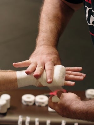 boxer gets his hands wrapped for a fight