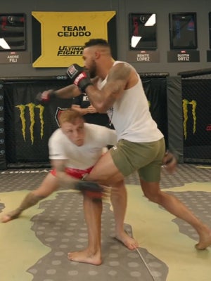 Wrestler shoots a takedown in MMA sparring