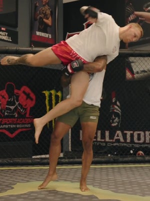 MMA fight picked up with high crotch takedown