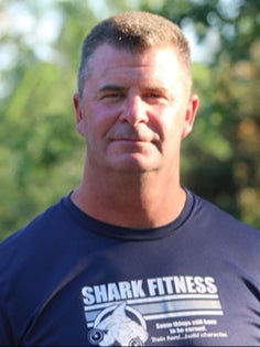 Headshot of Keath Hausher, founder and president of Shark Fitness Training and Patriot Training Foundation