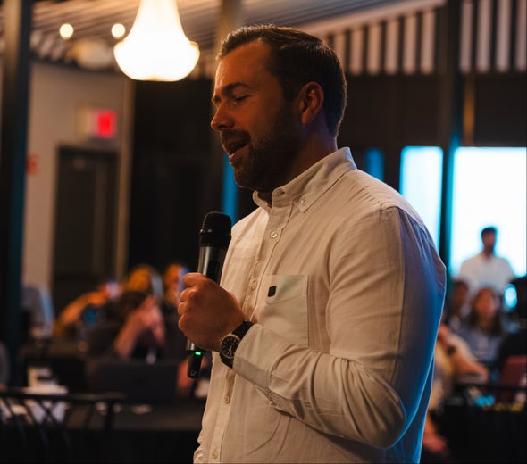 Daniel Kosmala speaking at a live event