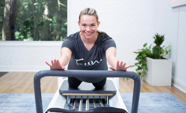 Member performing a Pilates Reformer exercise for P&FTV Reformer