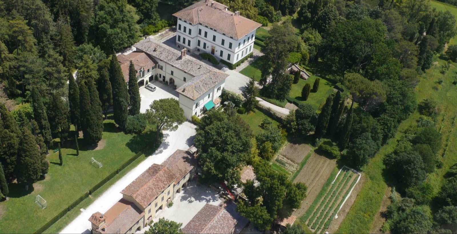 Aerial view of Villa Fassia, its garden, the farmhouse and the vegetable gardens among the woods