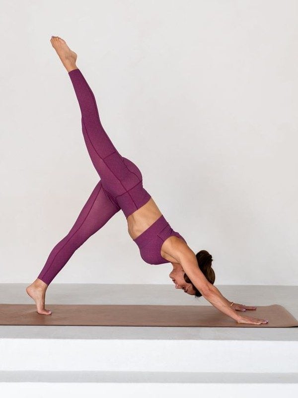 Maghan in a three-legged downward dog