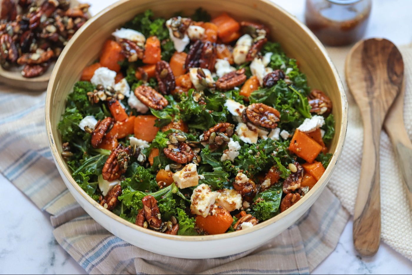 Pumpkin, kale and goat cheese salad in a bowl