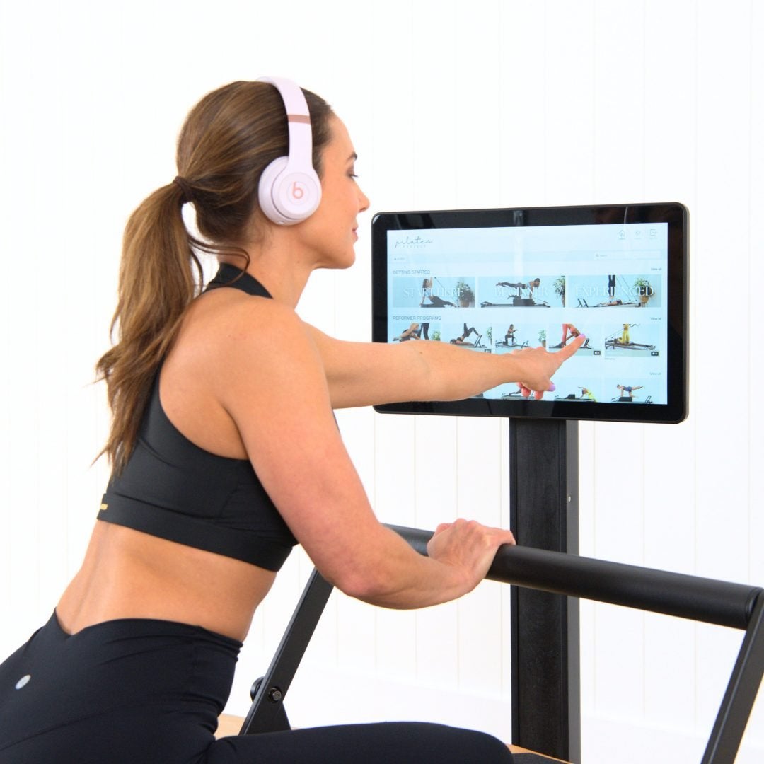 A member choosing a class on the StudioConnect touchscreen